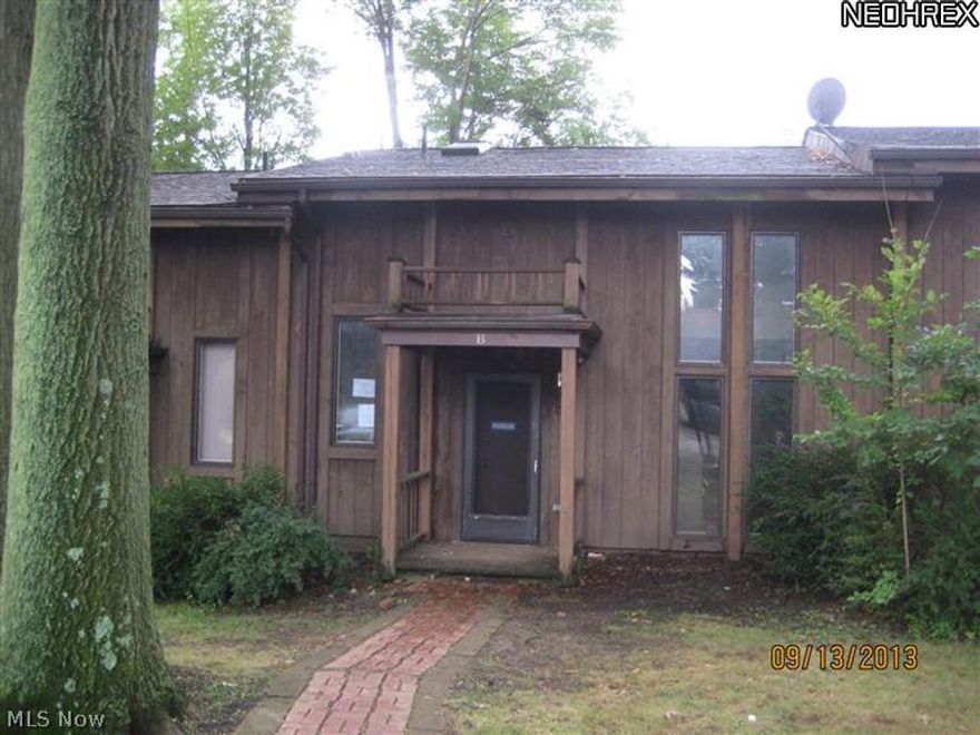 Townhouse style condo with new paint & carpet.  Master bedroom with walk-in closet.  Balcony overlooks living room.  Enclosed porch.  Sold "AS IS".  Buyer to verify all information.  Buyer or buyer's agent responsible to check with Building, Zoning, EPA, DEA, Tax Dept or any other requirement for intended use.  Buyer to pay for inspections.  Earnest money to be a Cashiers check.  Subject to clear title.