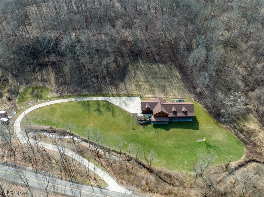 Custom built smart home on 13 acres! Words cannot do justice to this beautiful ranch home with a full walkout basement. The first floor offers an open floor plan with vaulted ceilings, double-sided stone fireplace, large dining area, nice office with built-ins, laundry room, custom kitchen with beautiful cabinetry and handicap accessible motorized features throughout, 4 bedrooms, 2 full baths and more. The HGTV-worthy master suite is so incredible you won't want to leave, especially after you see the walk-in shower. Downstairs you'll love the spacious theater room with wet bar, huge workout room, 3 additional bedrooms, full bath and walk-in gun safe with fireproof ceiling and concrete walls. Both floors are easily accessible with an elevator. Last but not least, spend time outside on one of the lovely composite decks; enjoy a heated driveway and the private setting this property offers. This is truly a one of a kind home and only minutes from town!