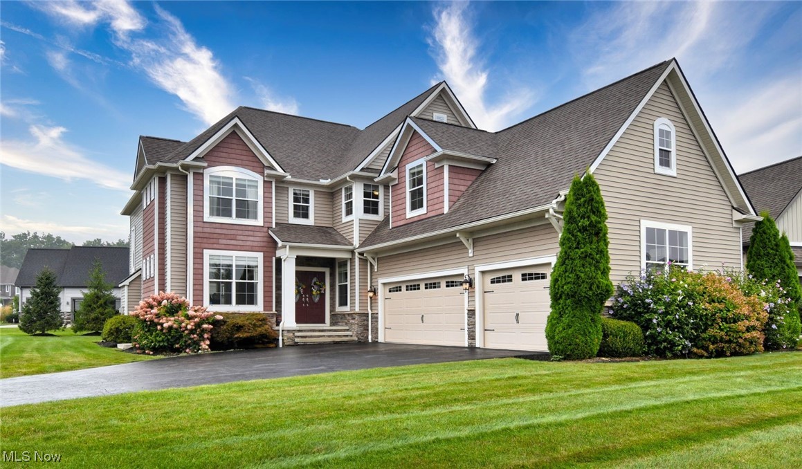 Here’s your chance to own a stunning custom-built Payne & Payne home, perfectly situated in the highly sought-after Canyon Lakes community in charming Chagrin Falls. This exquisite 5-bedroom, 5-bathroom residence offers luxury living with exceptional craftsmanship and upscale finishes throughout. Step into the gourmet kitchen featuring rich wood flooring, a striking stone-accented center island with sink, two-tone cabinetry, stainless steel appliances, and a beverage refrigerator. Designed for effortless entertaining, the kitchen flows seamlessly into the expansive great room, where soaring ceilings, floor-to-ceiling windows, a cozy gas fireplace, and hardwood floors create a warm yet sophisticated atmosphere. The main level also offers a formal dining room, a private office with built-in cabinetry, and a well-appointed mudroom for everyday convenience. Upstairs, retreat to the luxurious owner’s suite complete with its own fireplace, a private sitting room with dry bar, and a spa-like ensuite bath boasting a clawfoot tub, dual sink vanity, a walk-in shower, and two spacious walk-in closets. Three additional spacious bedrooms and two full baths and a versatile loft complete the upper level. The partially finished lower level offers even more living space with a private bedroom and full bath—perfect for guests, in-laws, or a home gym. Don’t miss your opportunity to own this extraordinary home in one of the area’s most prestigious neighborhoods. Schedule your private showing today and make this Canyon Lakes beauty your own. Motivated Seller!