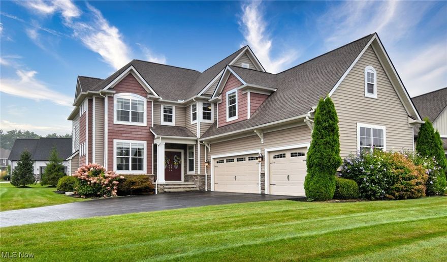 OWNER SAYS BRING OFFER! Custom built and perfectly situated in the highly sought-after Canyon Lakes community in charming Chagrin Falls. This exquisite 5-bedroom, 5-bathroom residence offers luxury living with exceptional craftsmanship and upscale finishes throughout. Step into the gourmet kitchen featuring rich wood flooring, striking granite  countertops and granite covered center island with sink, two-tone cabinetry, stainless steel appliances, and a beverage refrigerator. Designed for effortless entertaining, the kitchen flows seamlessly into the expansive great room, where soaring ceilings, floor-to-ceiling windows, a cozy gas fireplace, and hardwood floors create a warm yet sophisticated atmosphere. The main level also offers a formal living and dining room with crown molding and extensive millwork, a private office with built-in cabinetry, and a well-appointed mudroom for everyday convenience. Upstairs, retreat to the luxurious owner’s suite complete with its own fireplace, a private sitting room with dry bar, and a spa-like ensuite bath boasting a clawfoot tub, dual sink vanity, a walk-in shower, and two spacious walk-in closets. Three additional spacious bedrooms and two full baths and a versatile loft complete the upper level. The partially finished lower level, 13 course basement, offers even more living space with a play area for kids, private bedroom and full bath—perfect for guests, in-laws, or a home gym with ample unfinished storage space. Don’t miss your opportunity to own this extraordinary home in one of the area’s most prestigious neighborhoods. Schedule   showing today and make this  beauty your own. Walking distance to River Road Park behind this neighborhood  where you will find soccer and baseball fields.  Indoor and outdoor grilling.   walking  trails with magnificent view of iconic red barn and horses grazing. Fantastic playground   Motivated Seller!  AWARD  WINNING SCHOOLS, minutes to Chagrin Falls!  BRING  OFFER!