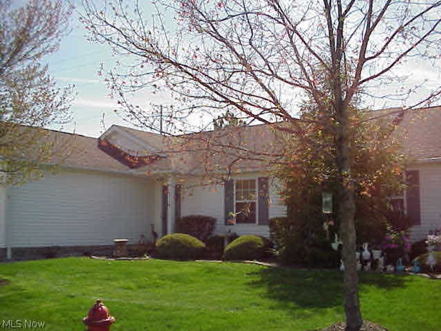 Very spacious two Bedroom, two Full Bath Ranch Cluster in Medina Township!  Open floor plan. Large Kitchen, with eat in area, has beautiful wood laminate floors. Entry Foyer with ceramic tile. Living Room, with vaulted ceiling, shows a gorgeous fireplace and walks out to a large private gated patio surrounded by charming landscaping and solar lighting.  Two car attached garage.  Monthly maintenance fee includes roof and siding.