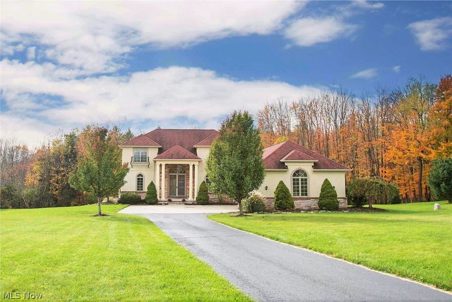 Beautiful Mediterranean Villa featuring 4 beds, 4 full baths, 6,388 sq.ft. of total finished living space, first floor master, Brazilian cherry hardwood, crown moldings, and many other elegant finishes. Enter through the foyer and into the light, bright, and spacious two-story great room with dramatic views, a wall of windows overlooking the private yard, skylights, fireplace, surround sound, and sliding doors to the expansive two-level deck and lower level patio. Gourmet Chef’s kitchen with upscale stainless steel appliances, Viking gas 6-burner, large island with prep sink, eat-in dining area with lit coffered ceiling, and access to the back deck for convenient outdoor entertaining. Private first floor master with vaulted ceilings, en-suite bath, Jacuzzi tub, multi-spray tiled shower, double vanities, linen closet, walk-in closet, plus a wall of windows and sliders to the back deck. The dining room, first floor laundry, guest bedroom, full bath, and access to the attached 3 car garag