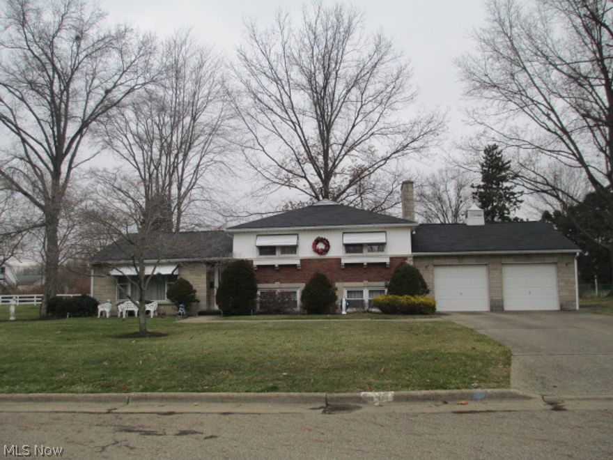 This 3 bedroom, 2 full bath brick split level in Brewster has so much to offer. This one has been well maintained by the original owner and just needs a few cosmetic touches. There is a large 28 x 12 three seasons room off the kitchen. Basement has a finished family room with fireplace and full bath. Has a large two car attached garage with extra storage. Large 1/2 acre lot located on a quiet low traffic street. One year home warranty included. This one is a must see at this price.