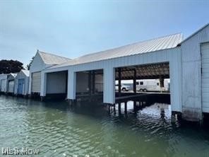 Nestle in this serene waterfront location offering the ultimate convenience and luxury for boating enthusiasts. Exceptional boathouse for anyone looking to maximize their water access. Newly updated featuring 2- 49 ft boat wells and 1- 26 ft boat well with 3 all new lifts, all new pilings, steel and concrete. All brand new doors. Use the docks or rent them out. Great investment.