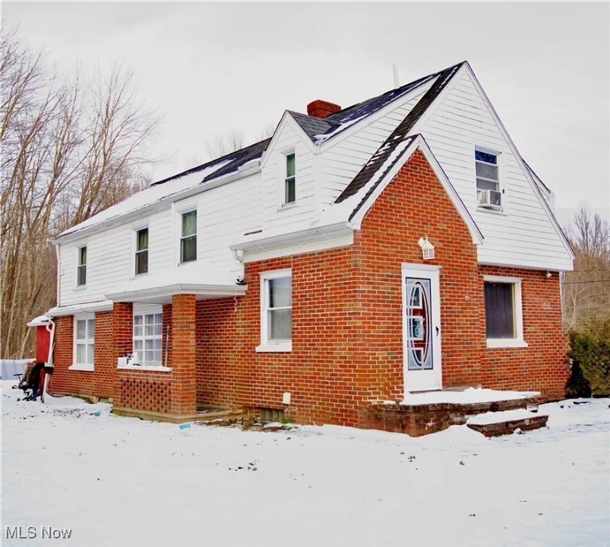 Don’t Let Your Eyes Deceive You – Nearly 1,900 Sq Ft with 5 Bedrooms!

This brick and vinyl home offers far more space than it appears, boasting nearly 1,900 square feet with five spacious bedrooms and two beautifully updated full baths. Freshly painted throughout, the home blends charm, functionality, and modern updates in a peaceful rural setting.

The large eat-in kitchen features stainless steel appliances, durable LVT flooring, and a big window in the dining area that fills the space with natural light. Just off the kitchen is a convenient first-floor bedroom, an updated full bath, and a spacious laundry/utility room. A practical mudroom and storage area connects directly to the garage.

Step up just a few stairs to the main front foyer and generous living room showcasing original hardwood floors and a cozy gas fireplace. Upstairs, you’ll find four additional generous bedrooms with  hardwoods and a renovated main bath highlighted by a charming window seat with built-in storage. Closet space is abundant throughout, including walk-ins.

Set on just under one acre, the property is surrounded by natural woods and offers privacy on a quiet rural street off State Route 534. A large outbuilding—currently used as a dog kennel and boarding facility—adds exceptional versatility for hobbies, storage, or business use.

Ideally located just minutes from Geneva-on-the-Lake and Lake Erie, and only 10 minutes to I-90, this home delivers space, flexibility, and location—perfect for a growing family, multi-use living, or those looking for room to spread out.