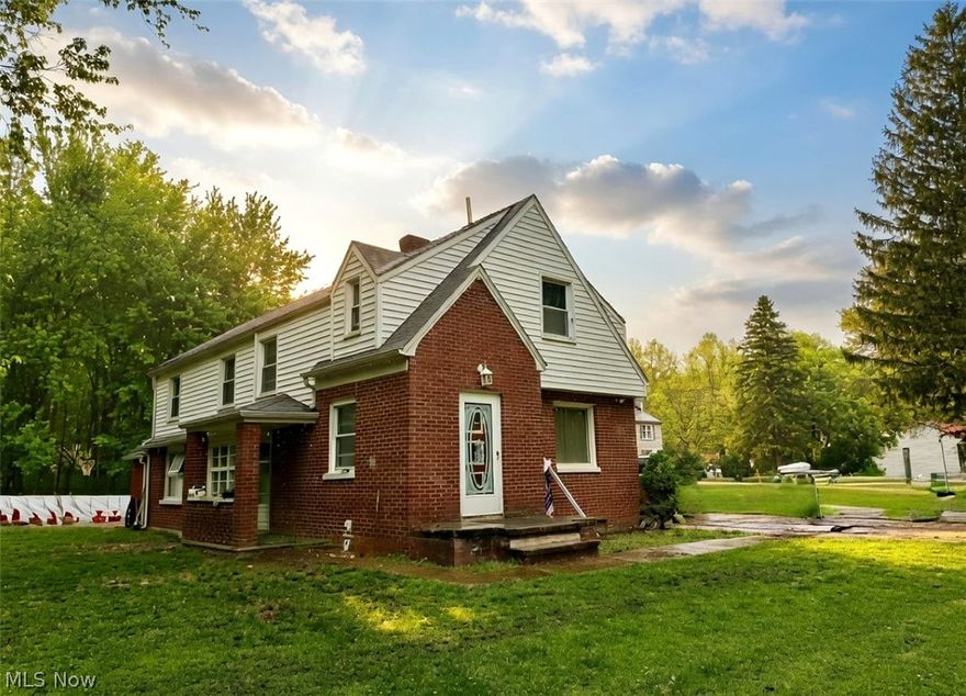 Don’t Let Your Eyes Deceive You – Nearly 1,900 Sq Ft with 5 Bedrooms!

This brick and vinyl home offers far more space than it appears, boasting nearly 1,900 square feet with five spacious bedrooms and two beautifully updated full baths. Freshly painted throughout, the home blends charm, functionality, and modern updates in a peaceful rural setting.

The large eat-in kitchen features stainless steel appliances, durable LVT flooring, and a big window in the dining area that fills the space with natural light. Just off the kitchen is a convenient first-floor bedroom, an updated full bath, and a spacious laundry/utility room. A practical mudroom and storage area connects directly to the garage.

Step up just a few stairs to the main front foyer and generous living room showcasing original hardwood floors and a cozy gas fireplace. Upstairs, you’ll find four additional generous bedrooms with  hardwoods and a renovated main bath highlighted by a charming window seat with built-in storage. Closet space is abundant throughout, including walk-ins.

Set on just under one acre, the property is surrounded by natural woods and offers privacy on a quiet rural street off State Route 534. A large outbuilding—currently used as a dog kennel and boarding facility—adds exceptional versatility for hobbies, storage, or business use.

Ideally located just minutes from Geneva-on-the-Lake and Lake Erie, and only 10 minutes to I-90, this home delivers space, flexibility, and location—perfect for a growing family, multi-use living, or those looking for room to spread out.