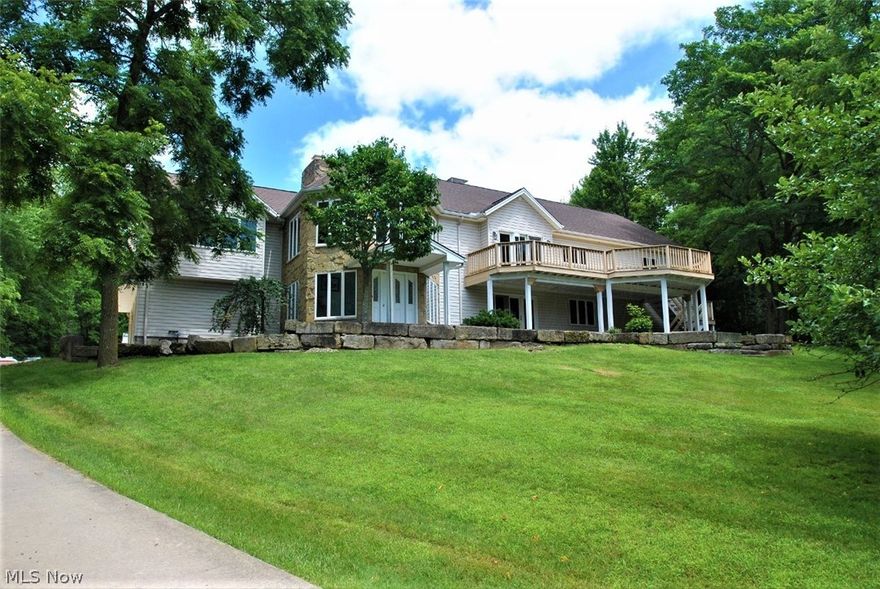 Private and Secluded 5 Bedroom Raised Ranch set back on 26+Wooded Acres! This spacious home was completely re-built in 1997 and offers over 5500 sqft of finished living space! Main floor living includes welcoming 2-story Foyer with wall of windows, vaulted Great Room with stone fireplace, 1st floor Office, Large Eat-in Kitchen with abundance of cabinets and counter space, center island, walk-in pantry and Breakfast area with gas fireplace. 1st floor Master Bedroom with vaulted ceiling, walk-in custom closet and slider to deck and heated in-ground pool. Huge Master Bath with soaking tub, separate vanities and shower. Full finished walk-out lower level has complete separate living quarters and includes Family Room with stone fireplace, 2nd Kitchen, 5th Bedroom, Bonus Room and full bath. Enjoy nature out every window. These beautiful acres include mature trees, walking trails and stocked lake. Whole house generator. 4-car attached garage. Wonderful home for entertaining and your growing f