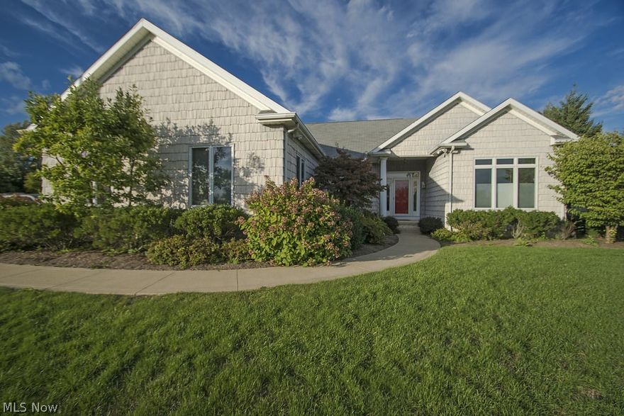 Quality custom built Ranch with 10' ceilings and nice, open, light and bright floor plan, beautifully perched on 1.53 Acre lot overlooking farmland and amazing sunsets.  This immaculately maintained home features a spacious Kitchen with island open to Great Room with fireplace, formal Dining Room, Living Room and Den.  Whole house generator, public utilities and 2320 sq.ft. Pole Barn with 12' overhead doors and workshop.  Truly spectacular!