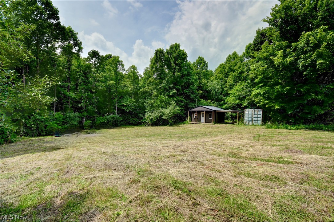 Experience the Ultimate Hunting Retreat in Newcomerstown - Now Better Than Ever! Discover the extraordinary potential of this remarkable hunting retreat in Newcomerstown! Situated on 83 sprawling acres, this property offers a pristine natural environment, with most of the land covered in woodland.
Key features of this property include a hunting cabin that serves as your private sanctuary amidst the wilderness. Additionally, a convenient storage container is available to house your ATVs and Side by Sides, ensuring your equipment remains secure and readily accessible. Elevated blinds offer optimal vantage points to observe and track wildlife, while a feeder attracts a variety of wildlife. This property is not only a hunter's paradise but also a sound investment opportunity. Whether you seek a new hunting spot or year-round entertainment for friends and family, this retreat is perfectly suited to your needs. Countless trails traverse the landscape, allowing for exploration on foot or by