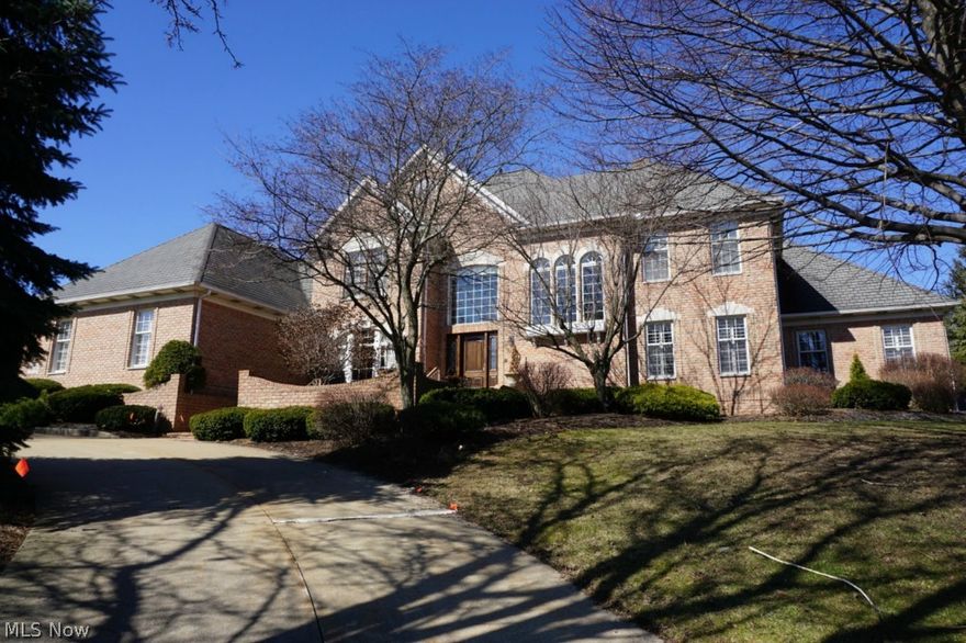 This very fine luxury home on Glenmoor’s 1st fairway offers 4-5 BRs, 4.5 baths, and 5,200 total sqft. Beautifully updated & redecorated throughout with hardwood flooring & impressive architectural details. Two-story foyer leads to dramatic great room with 18’ ceilings, 2-story windows, gorgeous fireplace & built-ins. Elegant formal dining room & warm study with built-ins. Recently updated (2014) kitchen features abundant cabinets, granite, new stainless appliances & bright eating area. Amazing first floor master bedroom with remodeled (2013) glamour bath & huge walk-in closets. Three large upstairs bedrooms; one with private full bath & two share large Jack & Jill bath. Beautifully finished lower level has family room with fireplace, full kitchen & bath, 5th bedroom, and office/bonus room. Large deck overlooks beautifully landscaped, private backyard with view of the fairway. You must see this exceptional home!