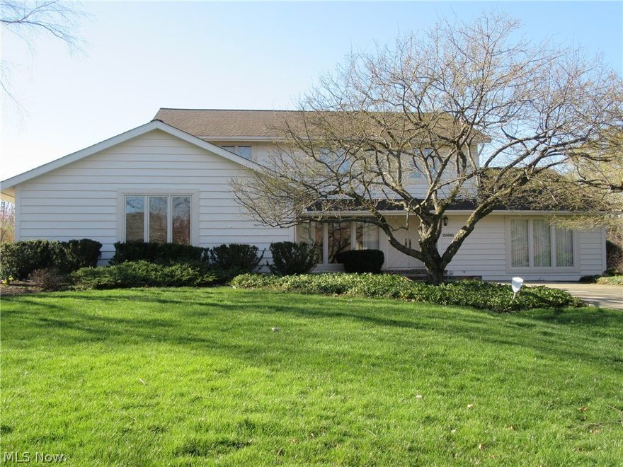 Wow! Great Cedar sided transitional Colonial on parklike 0.58 acre setting in prime Beachwood location. Near to schools, library, shopping, parks and recreation. Living room with vaulted ceiling and hardwood floor. Dining room with hardwood floor, and family room and library with hardwood too! 15 x 12 foot library with loads of built-ins. Family room and kitchen with newer french doors! Lovely kitchen with newer stainless steel appliances, including gas cooktop and center island, and 2 dishwashers! Fantastic utility/mud room. Master suite with vaulted ceiling, lovely bath with private shower and tub. Three ample bedrooms, all with great closets. Newer carpet throughout. Finished lower level ideal for playroom! Newer roof. This home is spotless! Must See!!