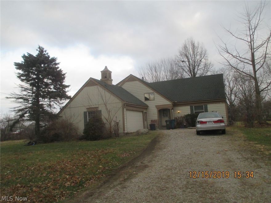 Multi level home with 4 bedrooms, partial basement, attached garage situated on large lot.