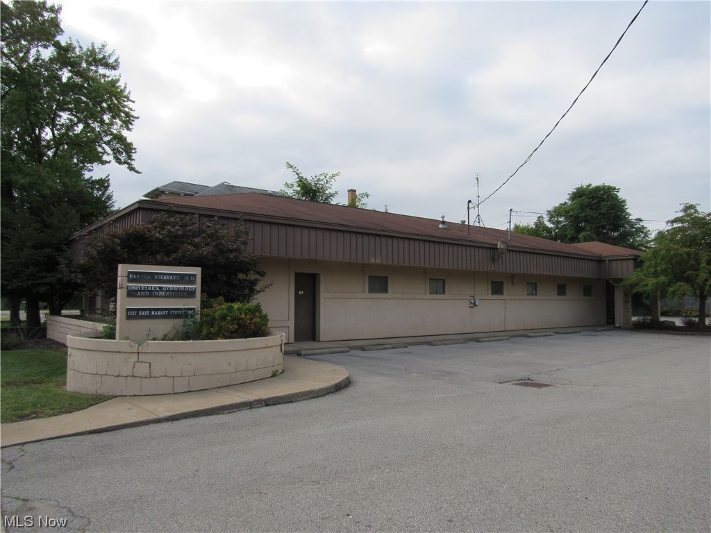 Office Building located blocks from the hospital. This building is currently used as a medical building that offers two additional parcels. In the current setting, there is a large waiting area and reception area with an office. There are currently five exam rooms with four potential private offices. There are two bathrooms on the main floor. On the lower level you will find an additional bathroom, a classroom and kitchen/break room.