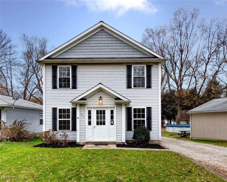 Take a tour of this lovely young colonial, built in 2004, close to everything Madison has to offer!  Enter through the foyer into the spacious living room, with plush new carpet and Fresh modern paint.  First floor laundry room, complete with shelving, and newer washer and dryer.  Convenient half bath is also on the main floor.  The Large kitchen boasts tons of oak cabinets, ample counter space, a pantry closet, and includes ALL appliances!  Eat in dining area has sliding glass doors that lead out to a wood deck and back yard, perfect for entertaining!  Upstairs you will find 3 bedrooms, all with brand new carpet, fresh paint, a full bathroom, and an efficient hallway office nook.  Updates include newer hot water tank, new carpet throughout the home, and fresh paint.  The home has a 1 car detached garage with man door.  Easy access to restaurants, shops, and the Lake Park right down the street! In the Desirable Madison Local School District!