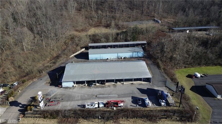 Commercial Opportunity on the busy Route 2 within minutes of the new wellsburg bridge! Sitting on 7 acres is a gated off blank 14,000 square foot building complete for multi purpose use, featuring office space with 11 offices. Also included is 3 very large machine sheds for equipment storage and a dual sided billboard to be rented out. Building was previously used as Aladdin Signs, this unique property is awaiting a new user. Call today to set up a tour.