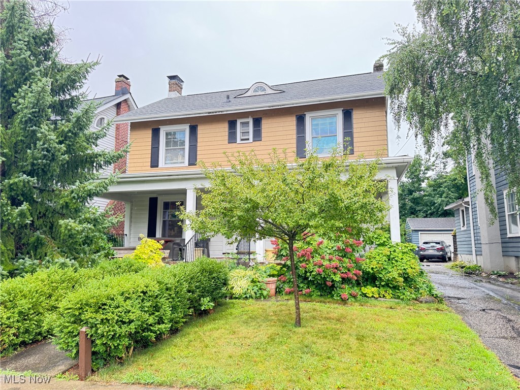 This Highland Square charmer has been beautifully maintained and enhanced by the same owner since 1971. Enter the expansive front porch into the sealed entry with beveled glass sidelights and porcelain tile flooring. To the left is the living room that runs from the front to the rear with a woodburning fireplace centered on the wall with french doors that lead to the rear patio and fenced yard. Perfect ceilings and crown moldings in the main level. The dining room has another fireplace (artificial) in the one corner and restored oak corner cabinets in two other corners. The kitchen at the rear has 80's Merilatt cabinets and a handy half bath close to the rear enclosed porch/entry. The hardwood flooring has been refinished in the entry, dining room, and all of the second floor bedrooms. Two rooms were combined upstairs to create one very large master bedroom with stunning maple flooring and a large closet. The bath is centrally located on the 2nd floor and still has the pedestal sink. The third floor consists of two rooms and a large cedar closet. The house has all replacement windows, a high efficient furnace and a brand new air conditioner and new hot water tank. The owner is an avid gardener and it shows in the wide variety of perennials. There is a nice patio and small water feature in the rear yard. There is plenty of room to park in front of the two car garage. Showings Aug 1-4 are only from 10-4 daily during a tag sale. After the sale on Monday other times will be available. The owner loved her antiques and belongings so come and take home a few treasures and check out the house while you're there.