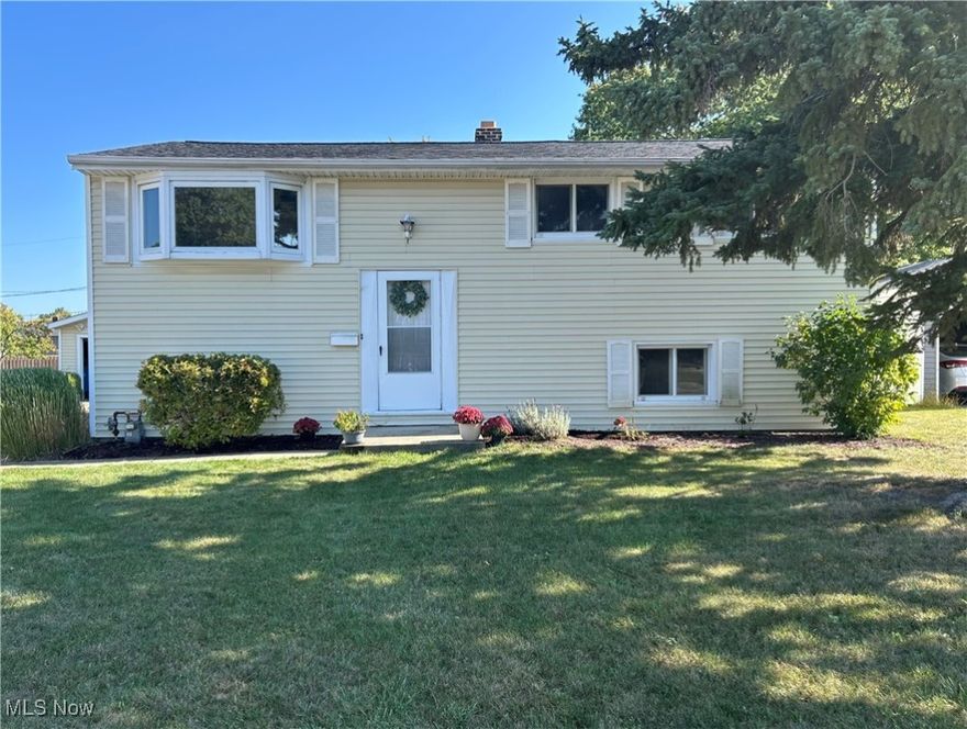 Step inside this classic bi-level home and find yourself standing in a flood of natural light on gleaming hardwood floors. The open entry, a front facing bay window and the vaulted ceilings add to the light, bright, airy feeling of this home’s freshly painted main level. It’s here you will find the large, light drenched living room, eat in kitchen, and a hallway leading to three bedrooms and a full bath. Sliding glass doors off the dining area lead to a large deck which overlooks the more than quarter acre private backyard. This raised deck is perfect for entertaining or for quietly planning your day while drinking your morning coffee. The lower level features a sizable family room, the home’s second full bath, a potential office, craft room or fourth bedroom, and a spacious laundry room. This lower level also features convenient backyard access. To top it all off, 211 W Overlook boasts a large, detached two car garage and a very accommodating driveway. Roofs on both home and garage are less than five years old. Recent driveway and sidewalk concrete repairs along with a passing dye test make this home POS compliant. Schedule your tour today!