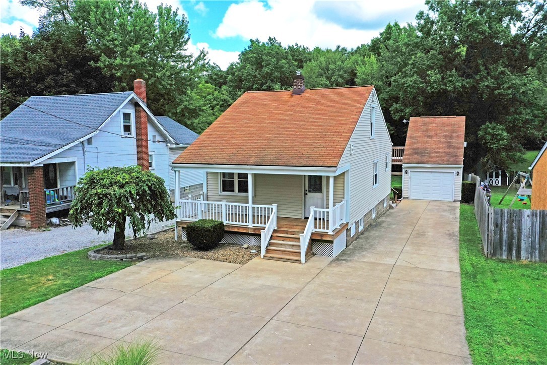 This hot-to-market Liberty Township home has all the right stuff for cozy living with a little bit extra! The great location puts you at ease for travel along with a nearby ice cream shop for a sweet treat whenever you feel. A cement driveway opens to a large turnaround for additional parking as it continues back to a single car detached garage. A massive rear deck finds a perfect place for relaxing and gathering with friends while a second staircase rises to an additional loft bedroom above the garage. The home itself welcomes with a covered front porch, opening to find a spacious living room with carpeted floors. Central dining takes advantage of large windows and decorative lighting. Meanwhile, the ample kitchen provides tasteful updates and immediate deck access. A first-floor bedroom ties into a gorgeous full bath with its wrapping, glass door shower. Upstairs, a large landing and second guest bedroom are available with plenty of closet space. Don’t miss out, call today!