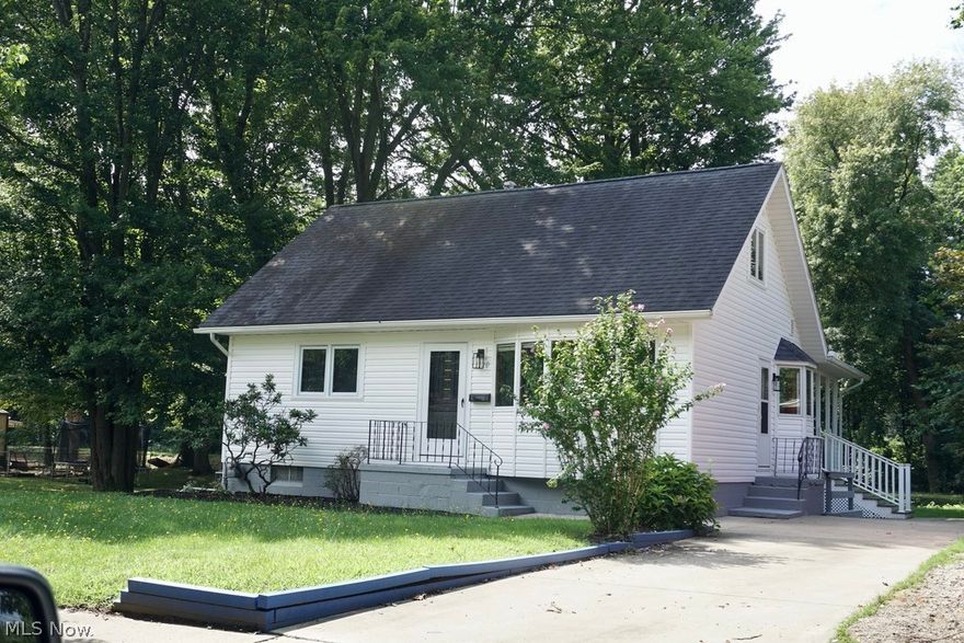 Fully renovated home in Castle Homes Allotment right on the Ohio Canal!! New Some updates include *SHAKER WHITE CABINETS WITH BUTCHER BLOCK COUNTER TOPS* UPDATED FIXTURES THROUGH OUT*  *HUGE NEWLY FINISHED ROOM IN WALK OUT BASEMENT WITH MINI BAR AND FRIDGE, RECESSED LIGHTING* perfect for entertaining. *LUXURY VINYL PLANK ON FIRST FLOOR AND FINISHED BASEMENT* Two FULL baths UPDATED* MUDROOM AT BASEMENT EXTERIOR ENTRANCE WITH BUILT INS* Larch covered porch with view of the canal in the private back yard. A great place to enjoy the walking trails, do some fishing or kayaking. Not far from Highway access and several amenities including those on Portage Lakes.