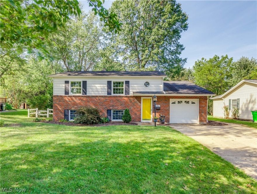 Welcome to this lovely well-maintained bi-level on a beautiful lot. Step to the front door and up the stairs, and you will find the living room with French doors leading to the master bedroom; this room offers beautiful built-ins, an abundance of natural lights, and access to the deck, which would be perfect for an office or home business as well. There are also three bedrooms on this floor, all with large closets, a linen closet in the hallway, and a full bath. Down the stairs is the updated eat-in kitchen with a beautifully accented tile backsplash, white cabinets, appliances, a pantry with pull-out drawers, and a movable kitchen island with a granite countertop. Open concept to the formal dining room with chair rails, a large closet, windows galore overlooking the backyard sit adjacent to the kitchen. A cozy family room, a laundry area with nature stone flooring, and a half bath complete the lower level. The laundry area has a walkout to the paver patio and the private fenced-in bac