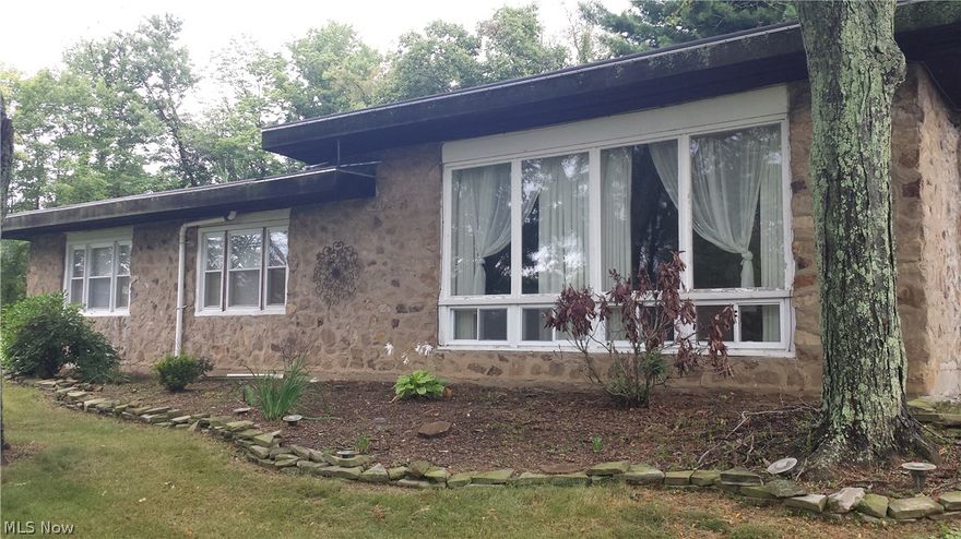This unique stone home is tucked away in the woods of the city. Offering a private lot AND the benefits of being in town. This home is within walking distance to Muskingum University, downtown and local schools.