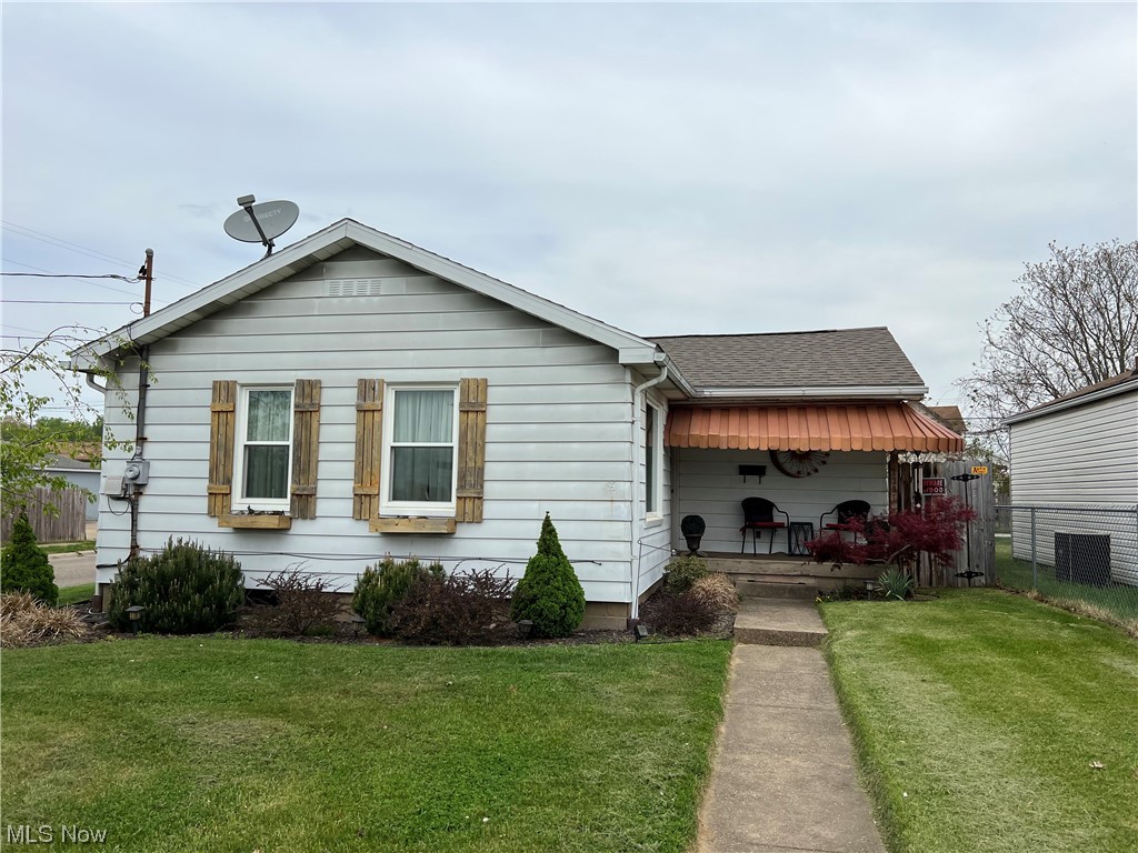 Cute as a button: 2 bedroom 1 bath with updated modern kitchen, new windows and roof! Featuring a 2 car detached garage with a cozy fenced in back yard.
