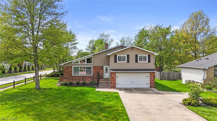 Prepare to be moved by this spacious four level split, located on almost a 1/2 an acre in the heart of Highland Heights. This four bedroom home has been meticulously maintained,  by the same owners for the past 24 years & it shows! From the moment you arrive, you will be impressed with it's stunning curb appeal, setting the tone for the experience you will have as you make your way throughout! As you enter the foyer you will be greeted by an abundance of natural light & vaulted ceilings in the spacious great room. The main floor also features a large dining room & beautifully updated kitchen- built for perfect functionality that overlooks the lower level family room. The lower level family room creates the perfect space to bring everyone together- whether you're by a fire on a cold winter night or having a backyard gathering with access to the amazing sunroom. However, the backyard will leave you breathless & this home is available just intime to enjoy the privacy, upgrades, & summer nights by a fire. The lower level also features laundry, a half bath & access to the oversized two car garage. This rare find split has a finished basement featuring a rec room, additional half bath (featuring a new shower), & another FULL kitchen. Perfect for an in law suite, home office, or teen suite. Upstairs you will be greeted by three generous sized bedrooms & a full bath. As well the oversized owners suite with a private half bath. This home shows the love and care that it has received for many years and the functionality with space is endless. This home features many upgrades from the stamped concrete to the newer roof. It is just waiting for you to come add your finishing touches