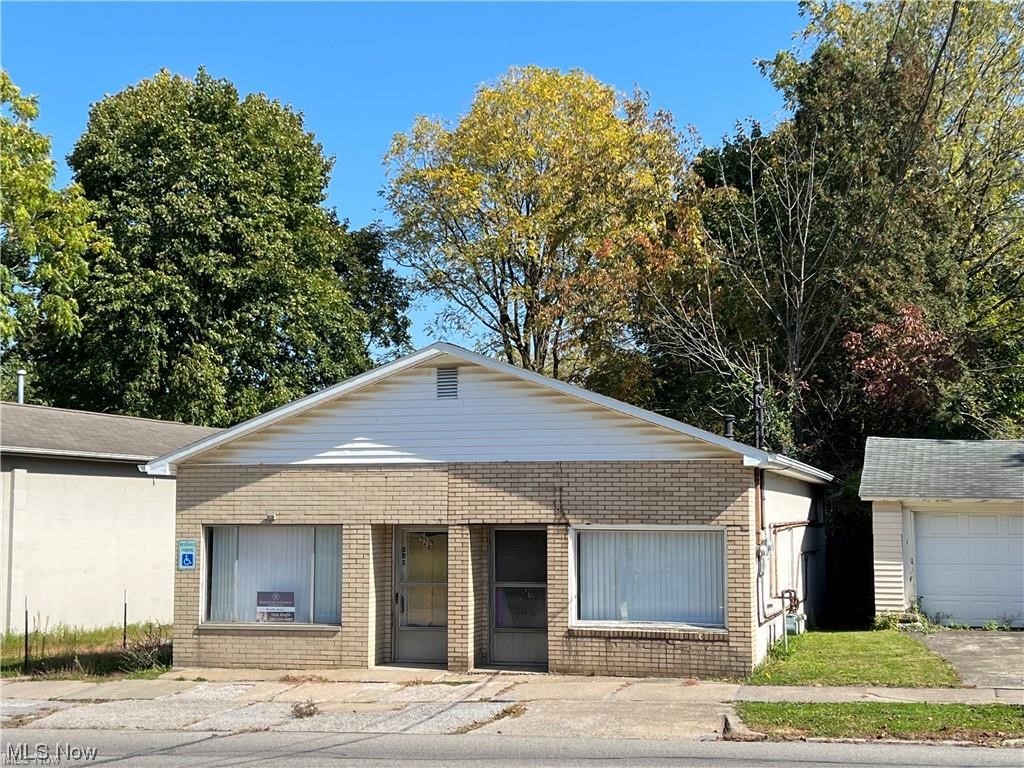 Nice commercial building located on a busy road in Struthers. Building is set up like a duplex with 2 entrances in the front and back. One side was previously a hair salon and the other office space. You can use the one side for your business or rent the other. Maybe turn them both into studio apartments? There is a driveway next to the building with parking in the real on a gravel lot. Great space in a great location!!!