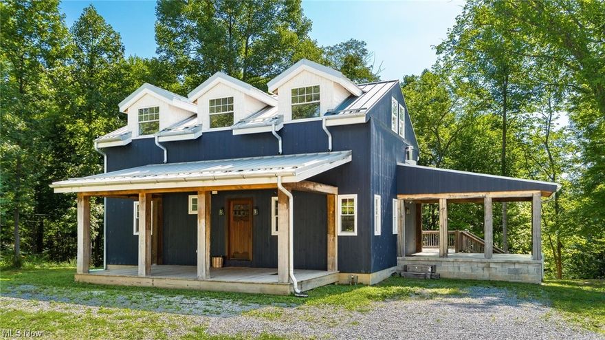 A beautiful secluded OFF GRID 92 acre property with TWO modern cabins, 36 ft x 60 ft x 14 ft barn w/basement, detached garage, & small cabin! Located 50 minutes from Hocking Hills, 1 1/2 hours from Columbus, & 2 hours from Cincinnati. Property is set up with solar panels for total off grid living at its finest! Includes a Generac generator as backup, rain water reclamation system for water source, & a well. Two modern cabins with rental potential, wildlife haven, Seclusion, & cell phone service. Barn is insulated and metal lined with a basement to house solar batteries. A property with truly unlimited potential awaits!!