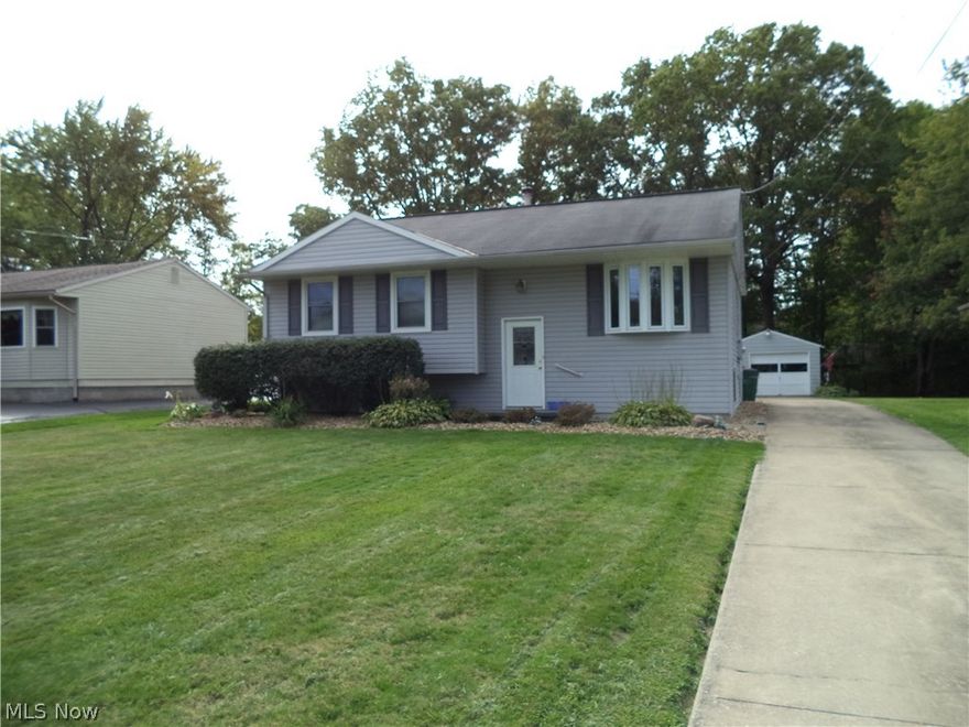 Clean & bright 3 bedroom, 1.5 bath bi-level. Home was extensively updated & has been well maintained. Kitchen/dining room features 3/4" wood floors, an abundance of counter space & cabinetry. Living room & hall have 3/4" wood floors & bay window overlooking neat front yard. Finished family room in lower w/paneling, ceramic floors, gas stove w/brick surround & half bath. Lower level also has large utility/laundry room. Exterior features new deck overlooking generous back yard w/detached 1.5 car garage w/opener.