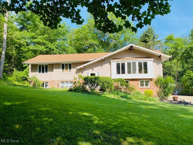 Spacious 4+ Bedroom, 2.5 Bath Raised Ranch on over 2 private acres in desirable Willoughby Hills. This home offers an open floor plan with walls of windows and a large eat in kitchen featuring granite countertops, a center island, ample cabinet space, and all appliances included. The dining room flows into the open living room with a wood-burning fireplace. The primary suite includes two closets (one walk-in) and ensuite with a tiled shower, jetted tub, double sinks, and LVT flooring. Two additional bedrooms on the main floor provide convenient access for family living.
The finished lower level is ideal for teens, guests, or an in-law suite, featuring a spacious recreation room, bedroom, office/flex space, laundry area, bar/countertop, cabinets and a full bath. Outdoor living is enhanced with an above-ground pool and deck, flagstone patio, full rear deck, extra gravel drive for additional parking and a generous yard to enjoy.
Car enthusiasts and hobbyists will appreciate the 2-car attached garage with a gas heater, plus a 2-car detached garage and an extra concrete pad—perfect for vehicles, boats, or additional storage. Set back from the road, this home offers privacy, peace, and quiet while remaining close to everything historic downtown Willoughby has to offer as well as easy access to the highway.