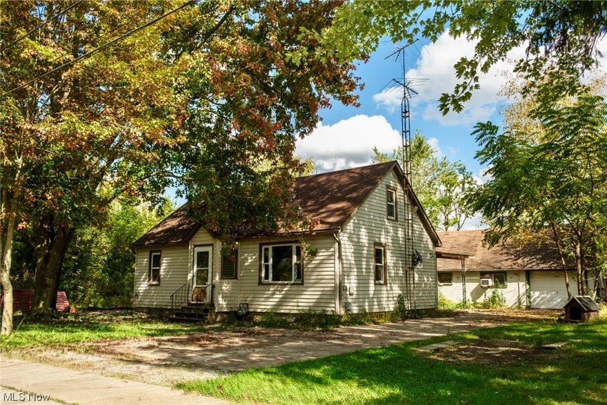 Loads of potential in this 5 bedroom Bungalow located on a dead end street! 3 bedrooms and 1 full bath are located on the main level with hardwood flooring throughout. Eat-in kitchen & family room also boast hardwood flooring. The second level provides 2 bedrooms and a quaint half bath. Large utility/mud room. 2 car detached garage with additional workspace room. Opportunity and potential continue with the bonus residential building situated on the same parcel with a 1 car attached garage and huge attic access/space. Extra building consists of 1 bedroom (possibly a second bedroom or office), 1 bath with washer/dryer, family room & eat-in kitchen. Listing details only reflect main home. 2 concrete driveways. Sold as is...NO repairs or changes to be completed. Does need some TLC. 2 homes for the price of 1! Extremely rare opportunity that won't last!