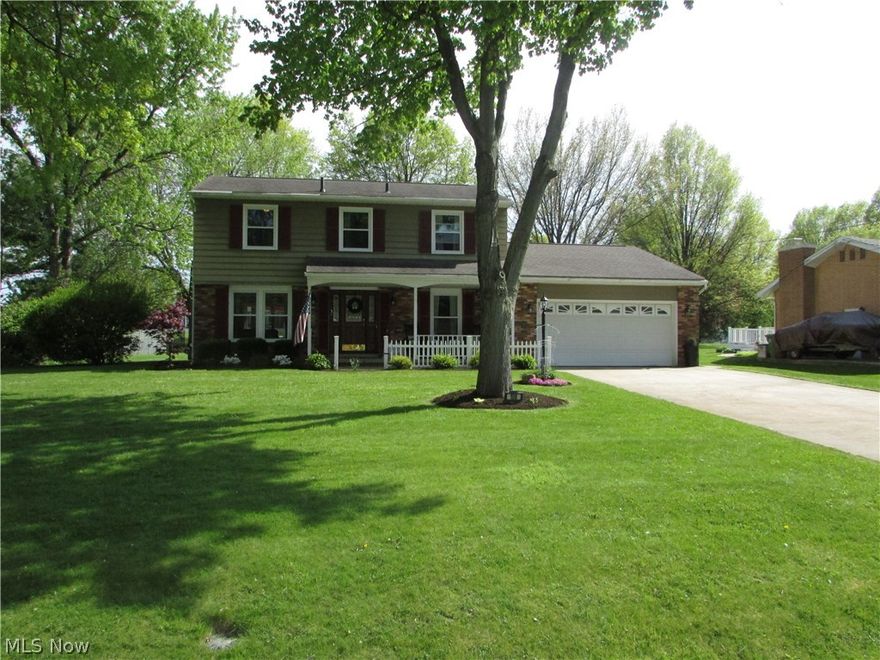 A stunning 4 bedroom, 2.5 bath colonial in Tallmadge.  This 2082 square foot home has a living room, family room, and sun porch.  The large living room opens to the deck.  The 18x12 Family Room has a fantastic wood burning fireplace, and opens to the 15x14 Sun Room.  An open kitchen has been updated.  With formal dining, a large deck, and a walk out basement, this home is set for entertaining.  Each of the bedrooms is spacious.  There is a large yard, shed, 2 car attached garage, and so much more.