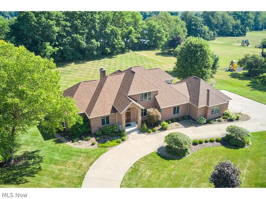 Discover your dream home in Arbour Green, situated on a picturesque 1.5 acre lot within the desirable former Bath Golf Course community. Custom-built in 2001 and extensively renovated in 2024, this residence offers a blend of elegance and modern convenience. The main level features a spacious first-floor owner’s suite with a newly remodeled master bath and dressing room, complemented by French doors opening to a private rear deck. The heart of the home is the chef’s kitchen, showcasing brand-new quartz countertops, a large center island, double ovens, and a custom pantry, seamlessly connecting to a bright four seasons sunroom. Adjacent to the kitchen is the expansive Great room with tall ceilings, a fireplace, wet bar, and access to the deck—perfect for entertaining. The formal dining room, private office, and a convenient laundry/mudroom complete the main floor, along with two half baths for guests. Upstairs, you’ll find two generously sized bedrooms and a full bath, providing ample space for family or guests. The recently remodeled lower level offers versatility with a fourth bedroom suite, complete with a full kitchen, full bath, family room featuring a fireplace, and a workout room—all with walkout access to the patio and backyard. Additional features include a built-in shed capable of housing two cars or lawn equipment, a side-loading three-car garage, and the convenience of public sewer. Located in the top-rated Revere School District and just minutes from Montrose shopping, this home offers both luxury and practicality. Schedule your private tour today to experience the charm and elegance of this exceptional property firsthand.