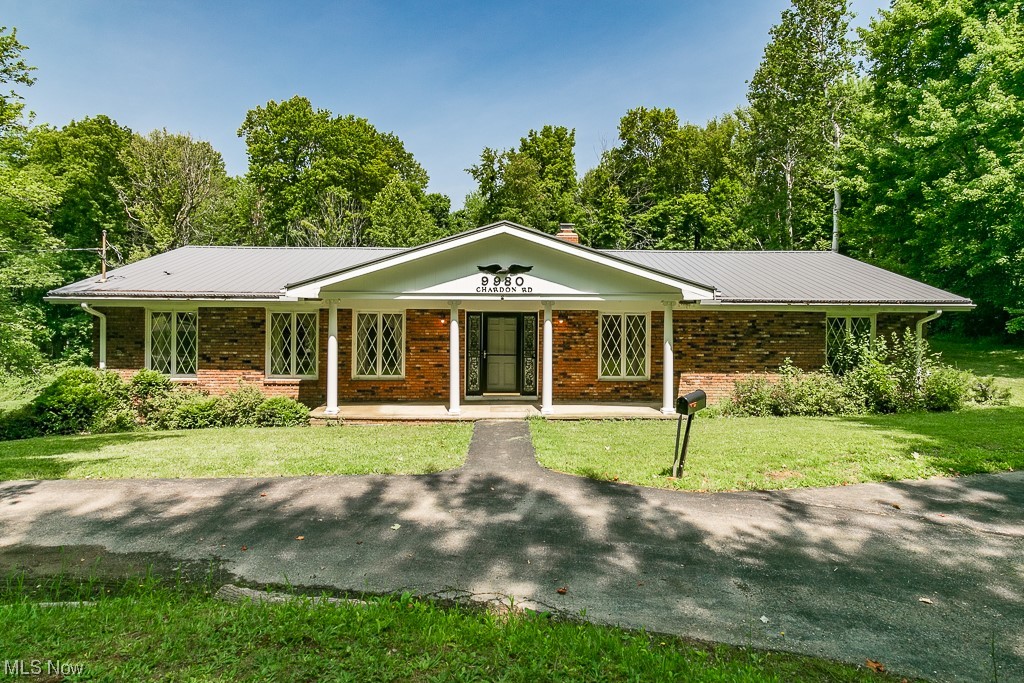 Welcome to this sprawling brick ranch in Chardon Township! The room sizes are absolutely AMAZING! The large living room has an office space off of it and then leads to the formal dining room that is the perfect place to host those dinners! Sliders lead out to the deck with views of the private back yard. The kitchen is large enough for a smaller breakfast table! A wood burning fireplace accents the family room that has hardwood flooring and beamed ceiling. Down the hall you will find 2 secondary bedrooms and a full bath. The master suite has a massive walk through closet to the bath! A full basement with walk out to garage awaits your finishing touches! Situated on 2 park like acres with circle drive, mature trees and close proximity to downtown Chardon! Don't let this opportunity slip by to own and put your stamp on this spectacular home!