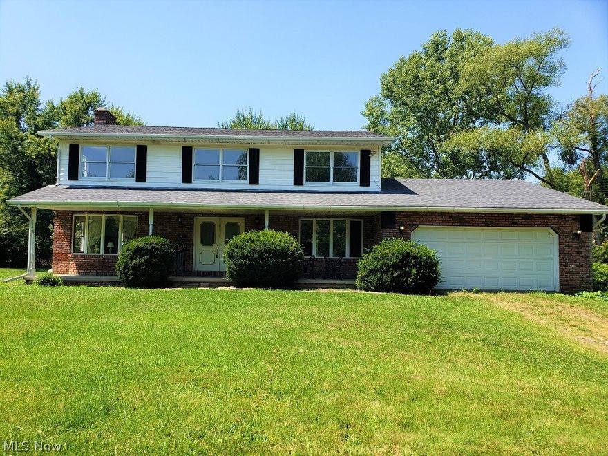 Tired of overpriced new construction with a postage stamp lot? Why not consider investing in this rare opportunity to live in the country on over two acres with the possibility of having two horses while still being only minutes to historic downtown Hudson??!! This classic colonial set off the road and has a desirable floor plan that includes an updated island kitchen with solid maple Kraftmaid cabinetry, separate eating area with access to deck and pantry, a desirable 1st floor laundry, a convenient 1st floor bedroom with adjoining half bath that could be converted to a full bath, a huge formal dining room with bay window, and a fireplaced great room with excellent view of the countryside.. The second level includes four generous bedrooms and two full baths including a private master bath with walk in closet and separate dressing area and a tiled guest bath. A stone faced fireplaced lower level awaits your finishing touches. Updates include many newer window panes, new furnace, and newer roof. Putting a bow on this excellent opportunity is a private tree lined lot on all sides with plenty of room to roam. All this and near shopping, fantastic parks and minutes to historic downtown Hudson and First and Main offering options for anyone's taste and social events year round. Come take a look before you look at anything else!!!