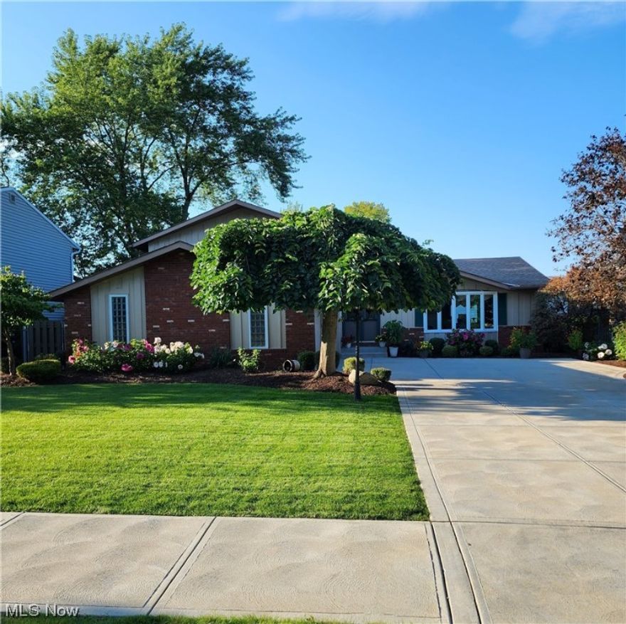 Spacious Split Level in the well desired Indian Creek !  * 4 Bedrooms and 2-1/2 Baths * Inviting Foyer * Living Room has a huge bay window (and floor area) that lets in a ton of natural light * Formal Dining Room with vaulted ceilings * Gorgeous Eat in Kitchen with Corian counter tops with an island/eating area with bar stools and storage, updated cabinetry and stainless steel appliances that remain * First floor Laundry Room has a lot of storage and appliances that remain * Large lower level Family Room with a brick/granite wall with a WBFP and doors that lead to the private fenced yard and extra large patio * Off the Family Room area is a wet bar (fridge stays), a 1/2 Bath and an extra room (being used as an office right now) * Curved staircase to the second floor which has an updated Full Bathroom and 4 large Bedrooms * The Master Bedroom has double closets and it's own private Full Bath with a walk in shower * Walk in closet in the upstairs hall has tons of storage * Basement has a