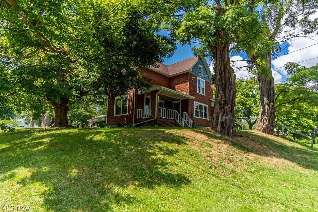 Wonderfully large home in West Branch Schools on .73 of an acre. with many updates! 4 bedrooms and 2 full bathrooms! The high ceiling make the rooms seem even more spacious! First floor laundry room with ceramic tile. Living room offers a wood burning fireplace and access to the porch. A full bathroom on the main floor and upstairs. Updates that were done about 2012/2013 - Roof, Furnace upstairs, Water Softener and bathroom added upstairs. 2014 (estimated date) New Electrical Service. Late 2021 new Windows. 2022 the whole house was painted inside, walls and ceilings. Summer 2022 New Carpet where there is carpet and new flooring in the kitchen and dining room.