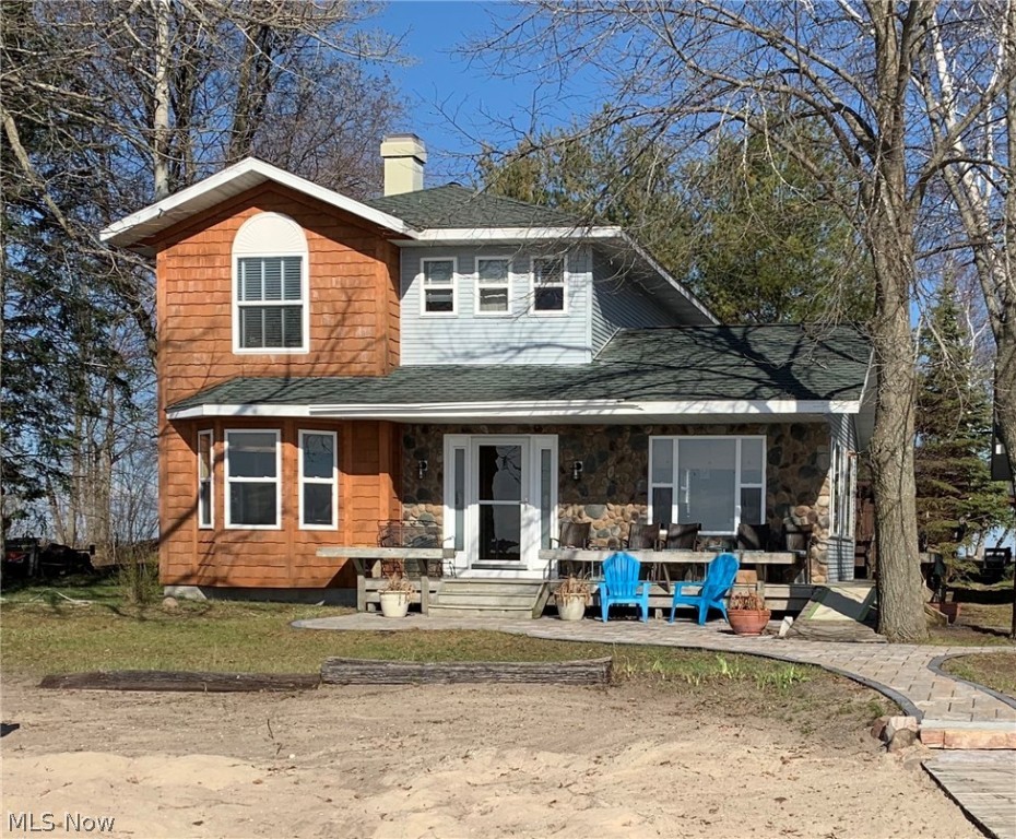 Welcome to beautiful Higgins Lake. This 3 bedroom, 2 full bath, 2 story home is located on the south side of Treasure Island. Enjoy over 100 feet of sandy beach right out your front door. Home features hardwood floors, a soapstone wood burning stove for those chilly nights, spacious open floor plan for entertaining, 1st floor laundry, all appliances included. Wrap around porch leads to deck outback or enjoy the beauty of the custom paver stone patio which extends to a fire pit built for outdoor cooking, warmth and entertainment. 1 car garage with double end overhead doors provides plenty of storage for outdoor equipment and toys for all your summer and winter recreation. Land Contract available. Higgins Lake is known for having over 20 miles of shoreline surrounding the lake, voted in top 6 most beautiful inland lakes, along with its sparkling water, it is said to be mostly spring fed with its deepest depth over 100’ and median is at over 40’. Great for sailing or fishing.