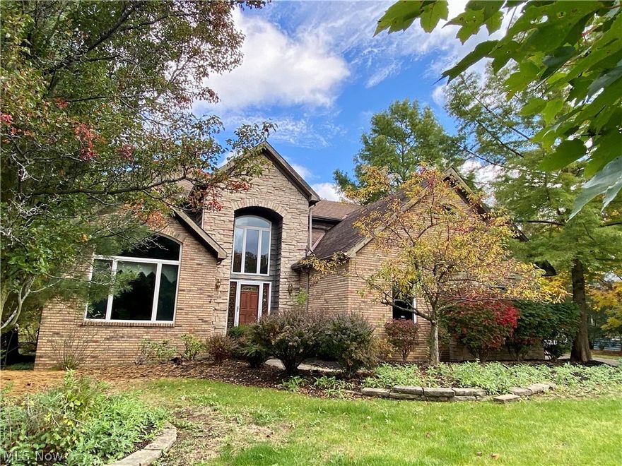 Great location on a quiet cul-de-sac street, close to schools, the park system, recreation center and all that Brecksville has to offer!  Classic two story foyer with warm hardwood floor and two quest closets.  Spacious two story great room with fireplace and wall of windows overlooking the private back yard and brick paver patio.  The family room features hardwood/parquet flooring. Open floor plan in the kitchen/great room.  The eat in kitchen with natural hardwood cabinets, stainless appliances, granite counters with Breakfast bar opens to the large great room with views of the back yard. Large eat in dining room space that is open to the living room area, custom marble flooring.  The living room space has a unique vaulted ceiling that overlooks the front yard.
Desirable first floor master bedroom with hardwood/parquet flooring.  The master bathroom features a double sink and custom marble finishes and a very spacious walk in closet with built-ins 11 X 9.  The second floor has 3 spa