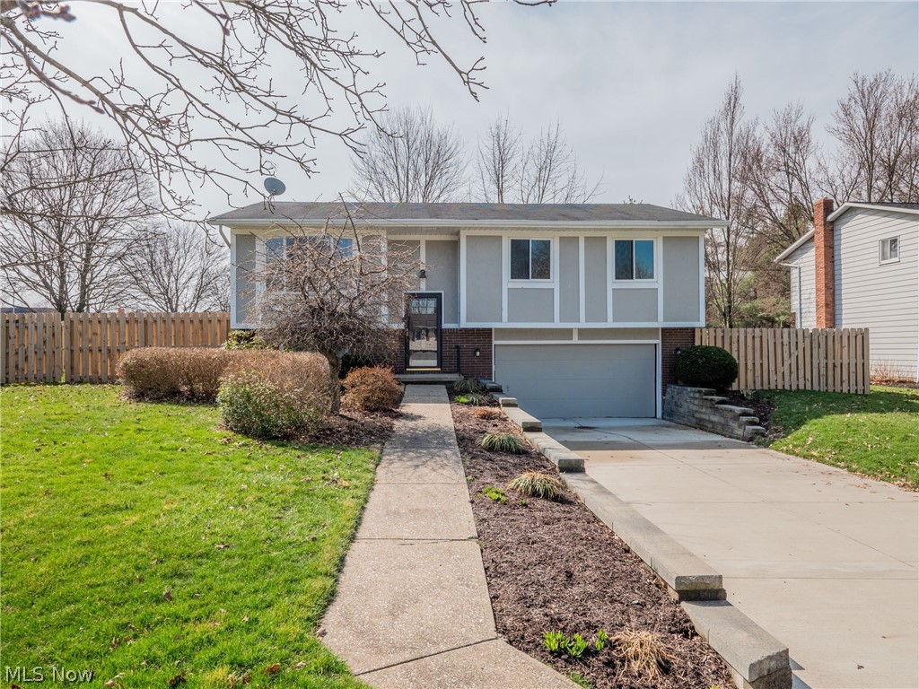 Welcome to this beautiful updated home in the heart of Twinsburg! This home has been renovated throughout. As you approach, you will find a newer driveway and extended walkway. On the main level, you will walk into the open and spacious living room that connects nicely to the dining room and kitchen. The kitchen features white shaker cabinets, granite countertops, and stainless steel appliances. The kitchen features plenty of storage space and a built in work area. Down the hallway, you will find three bedrooms and the main bathroom. The master bedroom features two generous size closets, access from the room into the bathroom, and a private deck! The main bath is completely updated featuring marble tile, quartz countertop and new and modern vanity with storage. Two nicely sized bedrooms round out the main level. The lower level features a large multi-use room. With the updated and attached full bathroom, the options are endless! The lower level also features a generous sized laundry ro