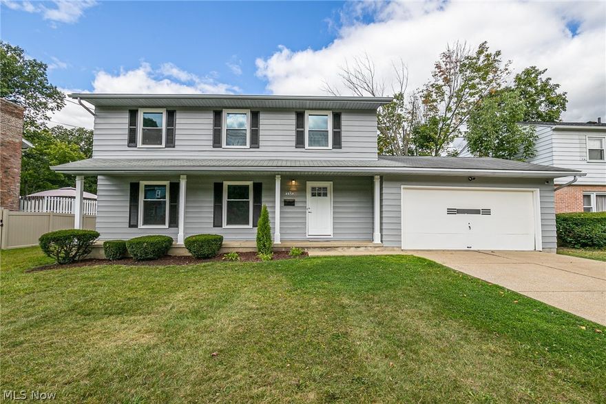 PRICE REDUCED OVER $22,000!  A complete interior remodel in this lovely West Akron Colonial.  This stunning home has 4 bedrooms, and 2.5 baths.  The flooring throughout the first floor is new.  The kitchen, and all 3 bathrooms are brand new.  The open concept eat-in kitchen features white cabinets, and beautiful wood counter tops.  The open family room has a large fireplace.  A large living room has ample natural light.  Upstairs features redone, natural hardwood floors.  The many updates includes windows, slider, front door, and more.  There is an attached 2 car garage, full basement (repaired wall), front porch, rear patio, nice yard, and so much more. Ask about the $5000 allowance!