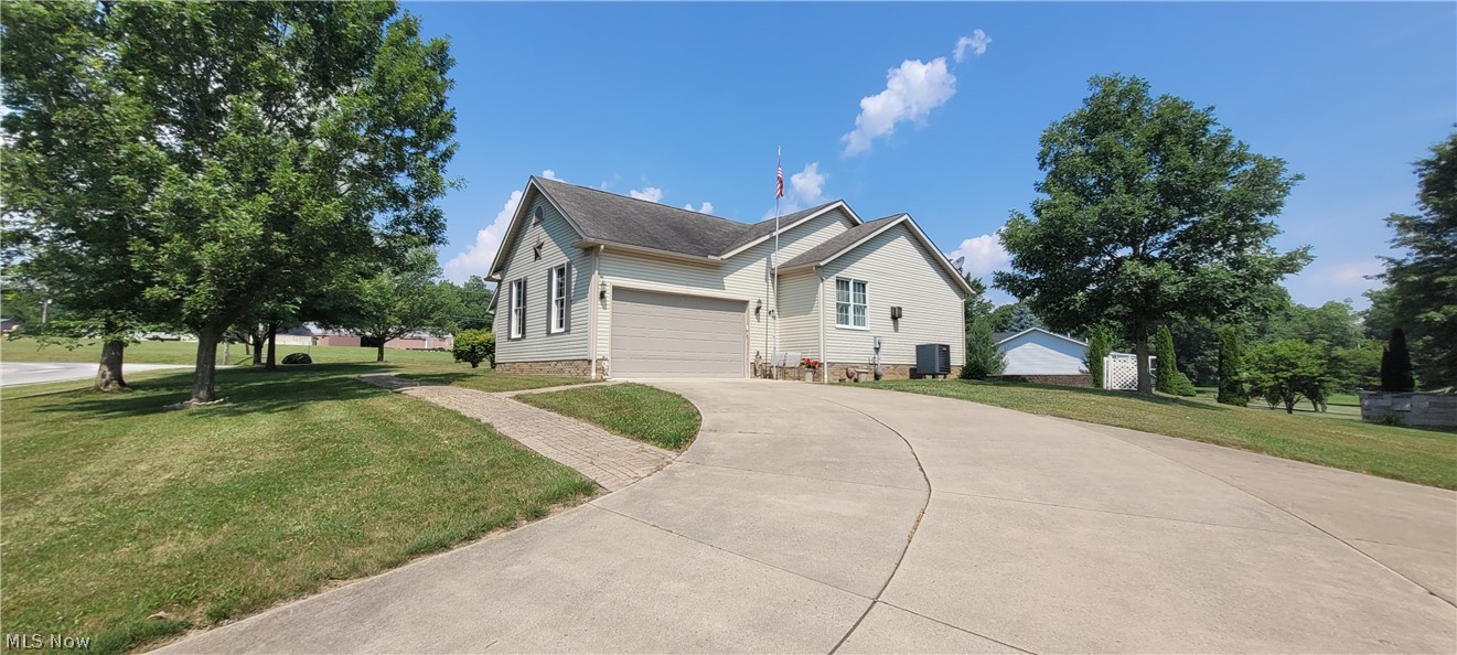 Come live in tranquility in gated lake community, great neighbors. Custom built Schumacher home, 2344 sq. ft., newer heat pump/AC. 3 generous sized bedrms, 2.5 baths, Oak doors & woodwork. Separate building 27x32 has work bench, air compressor, and vehicle lift. Rollup door accommodates taller vehicles. Living rm with cathedral ceiling, guest closet, gas fireplace. Kitchen has ceramic tile floors, Oak cabinetry with pull-out shelves, 42x72 granite island with cooktop, oven and storage drawers, inverter microwave, and pantry. You can enjoy coffee and talk at the breakfast bar while activity is going on in kitchen. Master bedrm has fireplace, en-suite bathrm with 2 vanities, walk-in shower Jacuzzi, 2 walk-in closets. Convenient laundry on main floor with laundry tub and newer washer & dryer. Large basement has paneled office and finished misc. use room with built-in storage cabinets. Also half bath and large unfinished room for games, pool table or TV. Attached 2-car garage is currently used for 1-car and a ramp into house. 900 sq. ft. patio has hookup for propane gas grill. Concrete driveway.