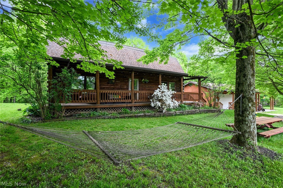 Total privacy is what you find when you arrive at the top of this amazing 2+ acres. The private unpaved driveway, at the end of the court, takes you uphill to this wonderful, loved custom built log-home. Surrounded by beautiful nature and a privacy that's hard to beat, it's location is just minutes from KSU, downtown and the highway, excellent commute in all directions. The huge front porch feels like a sanctuary surrounded by the property's own natures. The main floor is about the open, warm and comforting living-room and huge up-to date kitchen with breakfastbar and dining-area w/a built-in office behind barndoors and lots of storage space. Second floor provides 4 nice bedrooms and more storage space. Both floors provide full baths. In the walk-out basement you'll find a media/game-room, another bedroom, full bath w/laundry, utilities and additional storage. There is a 2-3 car garage and a shed. Don't let this pass by if you are looking for space, privacy and location!