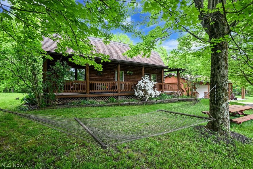 Total privacy is what you find when you arrive at the top of this amazing 2+ acres. The private unpaved driveway, at the end of the court, takes you uphill to this wonderful, loved custom built log-home. Surrounded by beautiful nature and a   privacy that's hard to beat, it's location is just minutes from KSU, downtown and the highway, excellent commute in all directions. The huge front porch feels like a sanctuary surrounded by the property's own natures. The main floor is about the open, warm and comforting living-room and huge up-to date kitchen with breakfastbar and dining-area w/a built-in office behind barndoors and lots of storage space. Second floor provides 4 nice bedrooms and more storage space. Both floors provide full baths. In the walk-out basement you'll find a media/game-room, another bedroom, full bath w/laundry, utilities and additional storage. There is a 2-3 car garage and a shed. Don't let this pass by if you are looking for space, privacy and location!