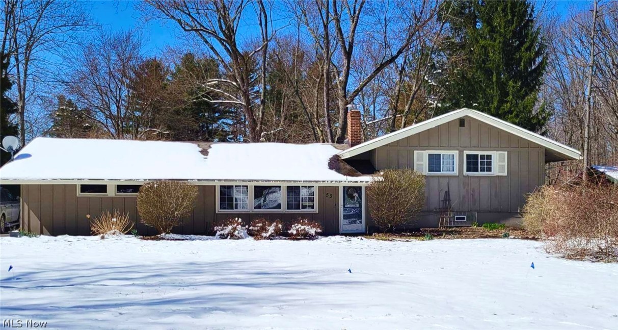 Wonderful Chagrin Falls school split level on a one acre lot! Dramatic vaulted and beamed great room luxury vinyl plank flooring throughout both 1st and 2nd floor. Floor to ceiling wood-burning fireplace. Functional galley kitchen is white and bright and overlooks the expansive backyard. 1st floor laundry and 1st floor full bath! Attached 2 car garage and a large freshly painted lower level family room with great recessed lighting for additional play or entertaining. Three bedrooms up share a full bath with chic new subway tile surround. Oversized deck and overlooking charming backyard is a great place to spend your spring, summer and fall evenings. Geauga County taxes and only minutes to downtown Chagrin Falls, schools, shopping and dining. Welcome home.