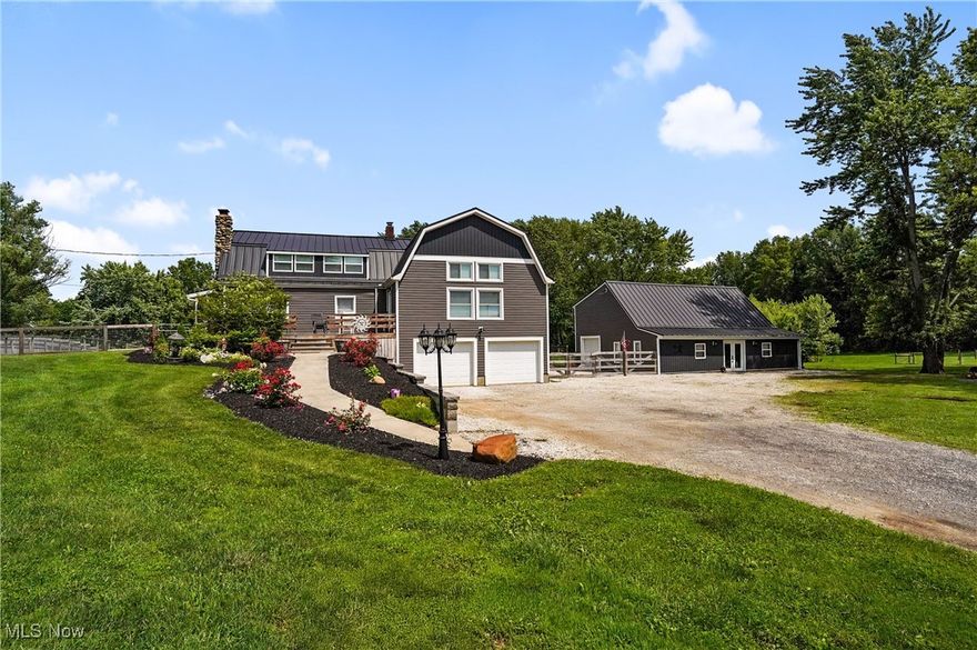 Unique and One-of-a-Kind property!  Private, scenic & thoughtfully reimagined, this home blends the charm of a log cabin feel with the sleek design of a modern contemporary home & has been updated beyond belief.  Step inside the Great Room to soaring ceilings and a wall of windows that provide an abundance of natural light.  The spacious dining area features sliding glass doors leading to a deck with gorgeous views. The updated kitchen offers new cabinetry, concrete countertops, tiled backsplash, & stainless steel appliances.  The first-floor bedroom, which once served as the original living room, features a woodburning fireplace. A beautifully updated full bath  completes the 1st floor.   Upstairs, the loft-style bedroom leads to an open bonus space—ideal for a home office, exercise room, or potential bedroom—with walk-in closet. Added dormers on the front and the back of house give this space a unique design.  An additional bedroom with a log cabin appeal and updated full bath complete the 2nd floor.  The lower level offers an updated full bath,  partially finished area has a WB stove, bar and sitting area, laundry room and is level with the 2 car attached garage plus there's another room that could be a 3rd garage.  The orignal horse barn has been redesigned as an outbuilding.  It is fully insulated, equipped w/ electric, mini split HVAC system, water access, concrete floors with drains, tankless hot water tank  (included but not yet installed).  This versatile outbuilding can house 5+ vehicles, boats, or any other toys. The newly added second story will give you options.  Major Updates in the Last 5 Years:  Metal roofs on house & outbuilding (with lifetime warranty), Vinyl siding, windows, sliding glass door, Solid 6-panel wood doors, New electric, plumbing, HVAC, hot water tank, sump pump, garage doors, flooring, added dormers front and back, New side porch, landscaping, block retaining wall, and sidewalks.  This is not just a home—it’s an experience.