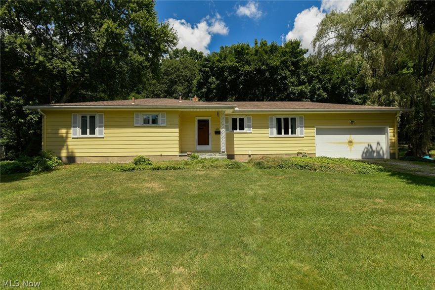 Easy living in this wonderful 1960 solid ranch home completed with hdwd flrs in bdrms, some built-ins, beautiful full brick wall gas fireplace,  all the custom specialties like kitchen cupboard drawer inserts, bread box, Pantry, extra depth on all closets, and a large bathroom with great cabinet and linen space as well as a pocket door to create separation between water closet and vanity sink. The huge living room is showcased by the brick wall fireplace and another wall of very large windows inviting the outdoors in.  The home is set in an amazing picturesque park setting, complete with your own path to the Summit Metro Bike and Hike Trail right behind your own treasure of a backyard. The location and backyard of this home is a dream for anyone loving the outdoors. Exciting bonus to the home is the fully screened in back porch to enjoy with friends and family or just sit back, relax, and watch the wild life! Marilyn is a loop Drive in a neighborhood with no outlet so traffic is minimu