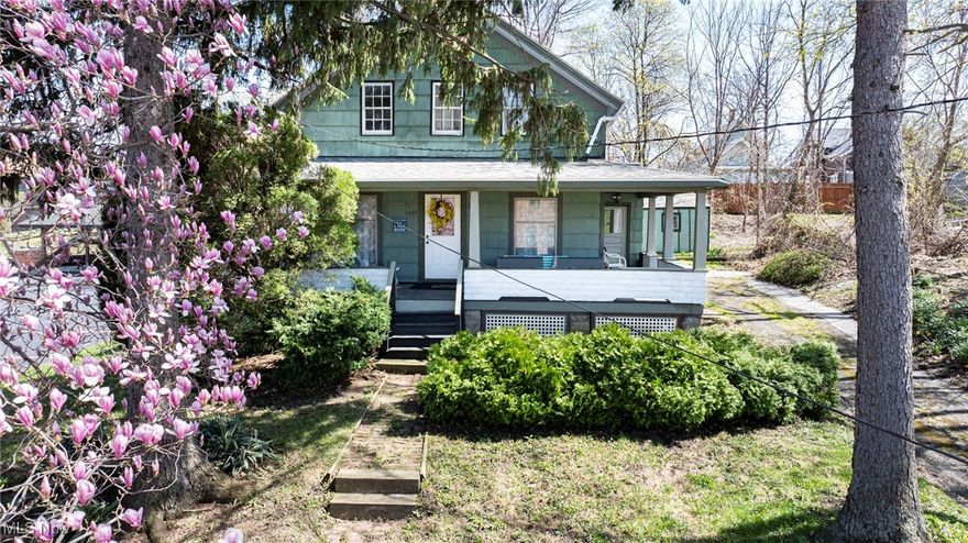 Step into a piece of Ashtabula history at 1420 Bridge St! This 5-bedroom, 1-bath vintage gem, built in 1892, has been lovingly cared for by the same family for over 100 years, each owner a tugboat captain for the Great Lakes Towing Company. Its story begins with Robert W. Simpson, the first owner and a local hero, who saved 8 souls from the schooner "Yukon" in 1905. After his heroic act, Captain Simpson received the prestigious Carnegie Hero Medal. Original architectural details include stunning colonnades and windows that have stood the test of time. Not to leave out the thoughtful updates, like the beautifully updated kitchen, plush new carpeting, and vinyl plank flooring throughout the main floors owner's suite. With 1,164 sq ft of living space, this home is designed for those seeking warmth, history, and modern comfort all in one. The home boasts a spacious porch that wraps around two sides. The front yard features towering Norwegian Spruce trees, planted by the third owner to remind him of his homeland. Imagine sipping your morning coffee here, soaking in the charm and history. A prime location for watching the bustling Bridge Street from your front porch. Just steps from 5-star restaurants, shops, and the historic Ashtabula Harbor, you'll be right in the heart of one of the areas most coveted locations. Not to mention, Lake Erie's shores are within walking distance, offering you that perfect blend of small-town charm and lakeside living. This home is perfect for those who appreciate character, community, and cultivating a home that stands the test of time. Don't miss your chance to own this piece of local history, where stories of the past continue to shape the future.
