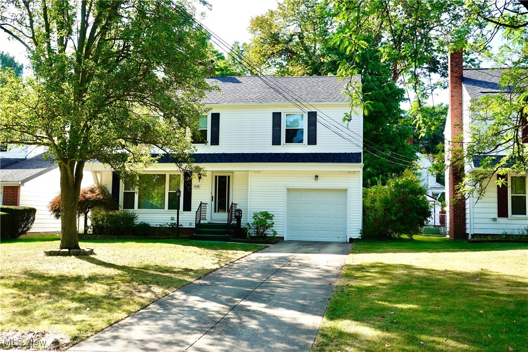 Looking for liiving space? Here it is! 4 bedroom colonial. Gigantic family room with raised hearth brick fireplace. Bright living room with another fireplace. Formal dining room. Large primary bedroom with walk-in closet. Recreation room in basement. Deck off family room overlooks wooded lot. Wow, it's a Naturestone floor in the garage! Stainless steel kitchen appliances. Roof & windows replaced approx. 3 years ago. Additional refrigerator in basement is included. Enjoy great Lyndhurst city services and amenities, including city park, pool, playground, splash pool and tennis courts.